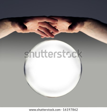 hands over a crystal ball of fortune with a clipping path