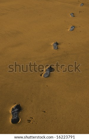 carbon footprint tracks on a beach in ireland