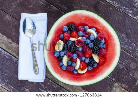 Healthy organic fruit salad in carved watermelon