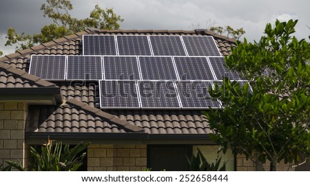 Solar photovoltaic panels installed on tiled roof