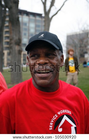 MADISON, WI-MAR. 24:Actor Danny Glover smiles to supporters during a march for immigrants rights in Madison, Wisconsin on March 24, 2007.