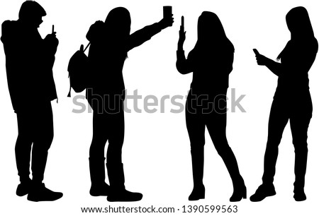 Silhouettes of people making photos.