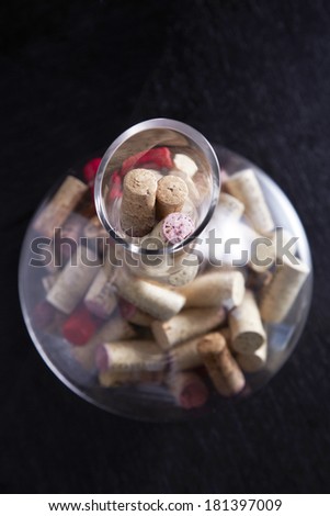 Wine cork in glass jar on black table
