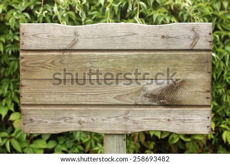 wooden plaque on vine background