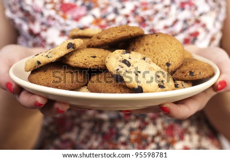 woman with plate of cookies close up