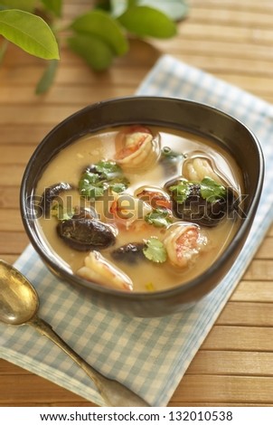 Thai spicy tom yam soup with shrimps, mushrooms and coconut milk