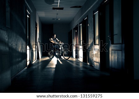 big man on bike in the office