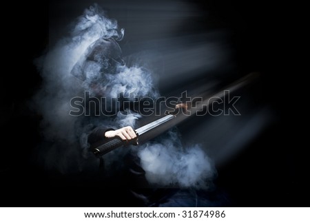 Ninja in action with sword at night in smoke