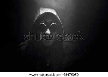 angry man with goggles in smoke