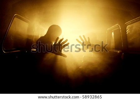 silhouettes of passengers in the car full of smoke
