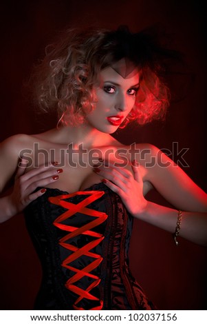 fashionable woman with art visage - Burlesque Dancer
