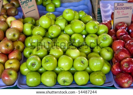 Three (3) kinds of apples, Granny Smith, Red delicious, stacked at a fresh farmers market