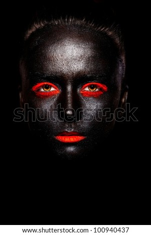 High fashion look.glamour fashion beautiful black American woman in black mask with orange bright makeup and orange lips
