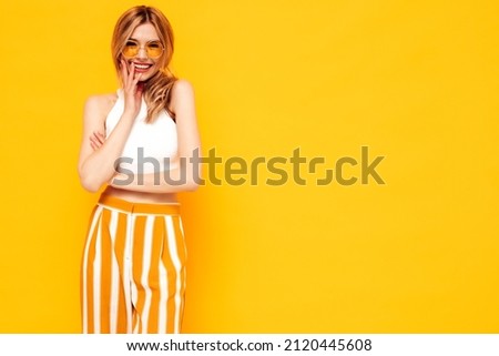 Image, Stock Photo Positive young female model in sportsclothes rides on blades enjoys leisure activities poses at urban place against blurred background stands in full length. Active lifestyle and rollerblading concept