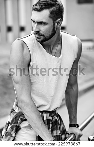Portrait of sexy handsome model man in casaul cloth in the street