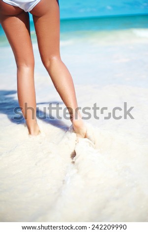 sunbathed Girl with perfect figure run in summer beach sea
