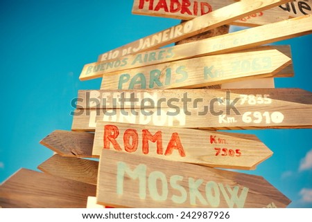 traffic road  sign including Moscow, Roma,London,Berlin,Paris,Madrid, Rio de Janeiro on blue sky background