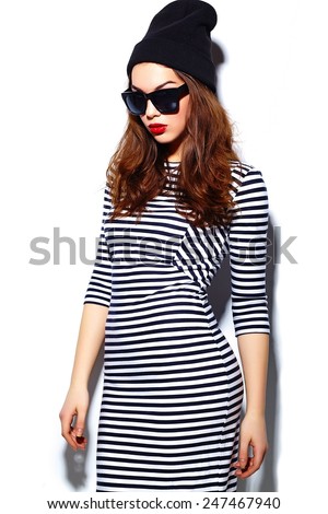 High fashion look.glamor stylish beautiful  young happy smiling woman model with red lips  in zebra dress in black beanie