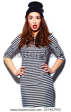 High fashion look.glamor stylish beautiful  young happy smiling woman model with red lips  in zebra dress in black beanie
