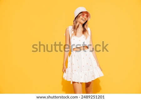 Similar – Image, Stock Photo Young blonde woman in summer outfit looks at the sea