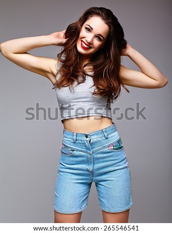 High fashion look.glamor stylish sexy smiling beautiful young woman model in summer bright jeans shorts hipster cloth