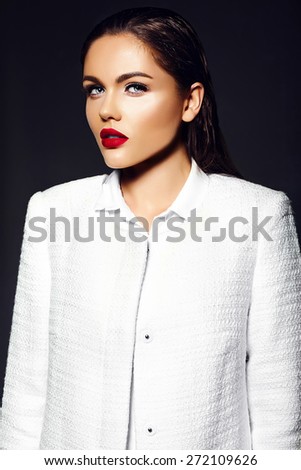 High fashion look.glamor closeup portrait of beautiful sexy stylish brunette business young woman model with bright makeup with red lips in white coat jacket
