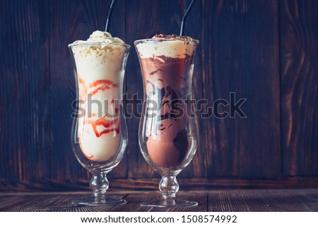Two glasses of milkshake on the wooden background ストックフォト © 