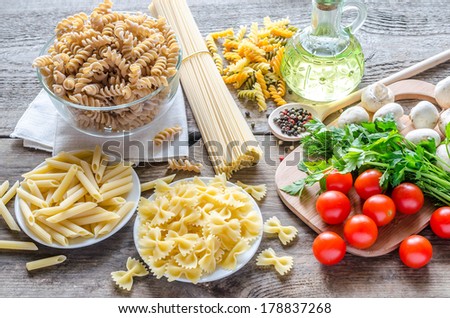 Various pasta with mushrooms and cherry tomatoes
