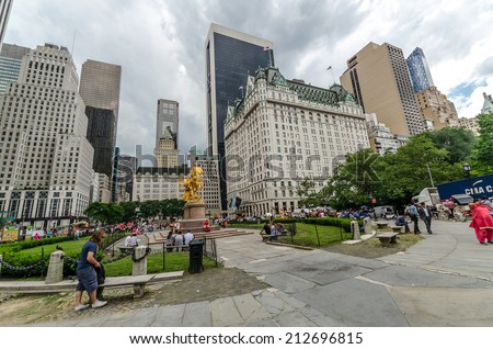 NEW YORK CITY - JUL 17: Grand Army Plaza in New York on July 17, 2014. Grand Army Plaza lies at the intersection of Central Park South and Fifth Avenue in front of the Plaza Hotel in Manhattan.