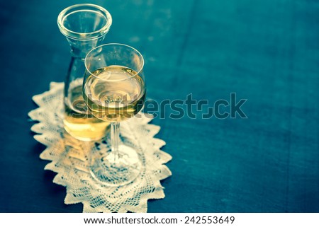 Glass of white wine in vintage decor