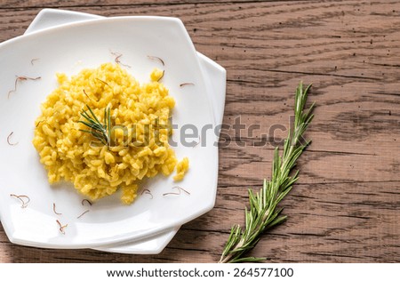 Similar – Rosemary on risotto with rabbit and mushrooms