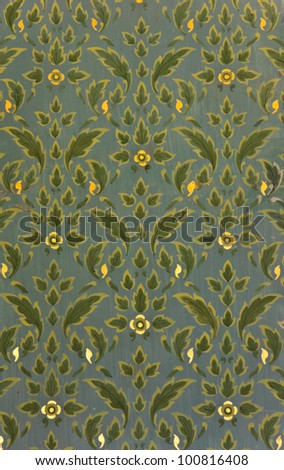 Green Thai floral pattern on temple wall