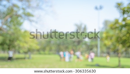 Blurred people background having activities in green park