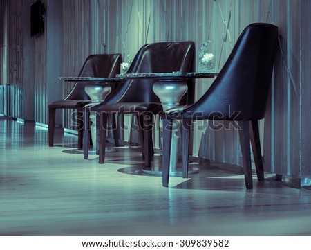 Empty chair at the hotel lobby in retro style
