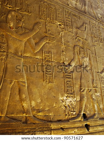 Reliefs of Pharaoh and Horus god in the interior wall of Edfu te