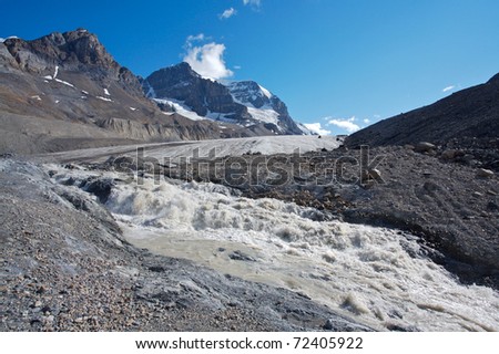 Athabasca glacier with melt water, Mount Andromeda in the background
