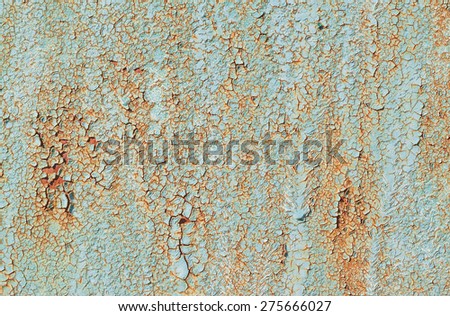 texture of old green peeling paint on metal wall