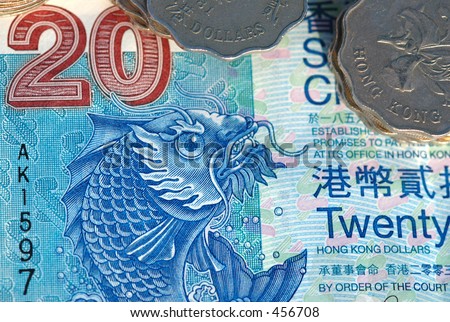 Macro of Hong Kong money, a twenty (20) dollar bill and a pile of coins
