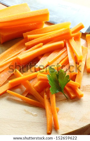 carrots cut into sticks and leaf of parsley