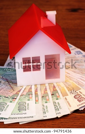 house model and money. Real property or insurance concept