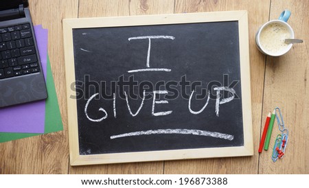 I give up written on a chalkboard at the office
