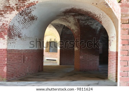 Brick arches and walls inside the halls of Fort Point