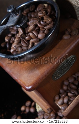 Fragrant natural fresh black coffee in a manual coffee mill