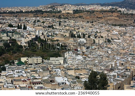 Africa . Morocco . The city of  Fes., the top view shows the city streets , mosques , away , in the background of the Atlas mountains .