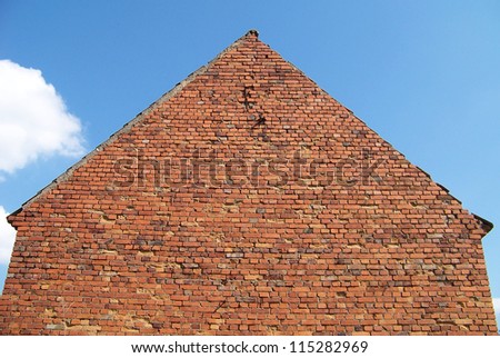 Regular shaped old brick house side photo