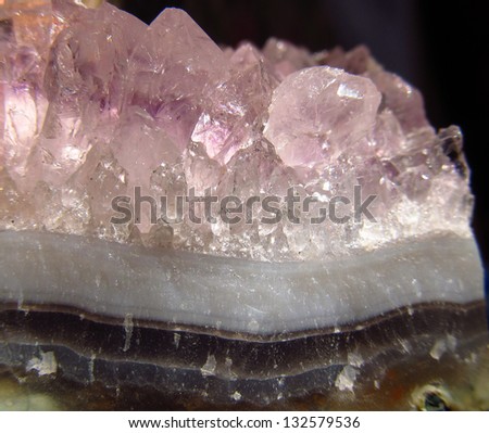 Dense cluster of pink/purple amethyst semi precious crystals