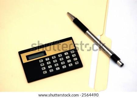 File, calculator and pen against a white background