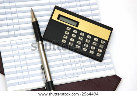 check book calculator and pen against a white background