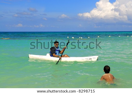 A kayak man saving the life of a kid