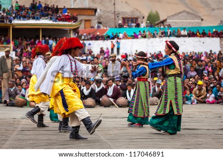 LEH, INDIA - SEPTEMBER 08: Young dancers in traditional Ladakhi Tibetan costumes perform folk dance at the Annual Festival of Ladakh Heritage in Leh, India. September 08, 2012